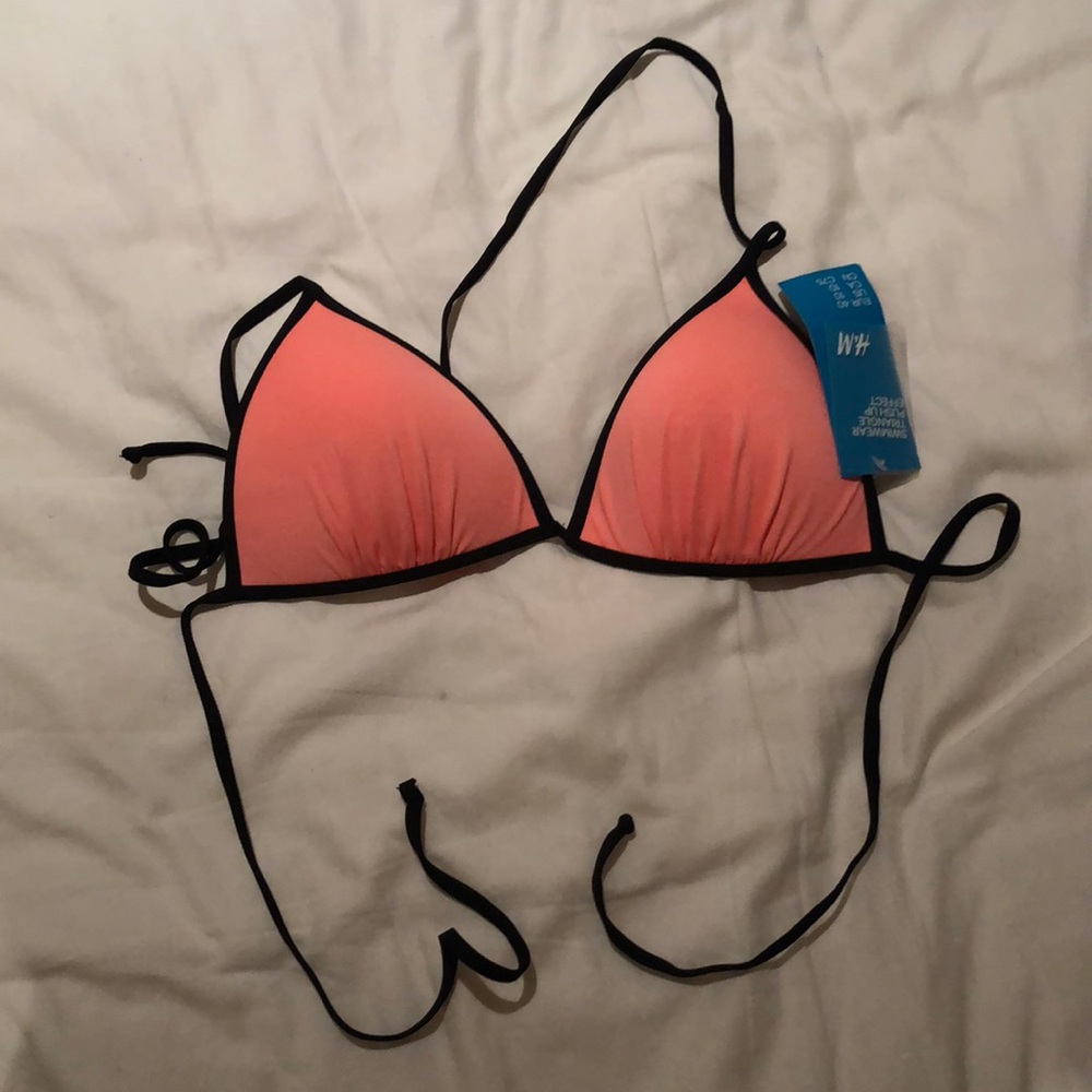 Tags still on bathing suit top